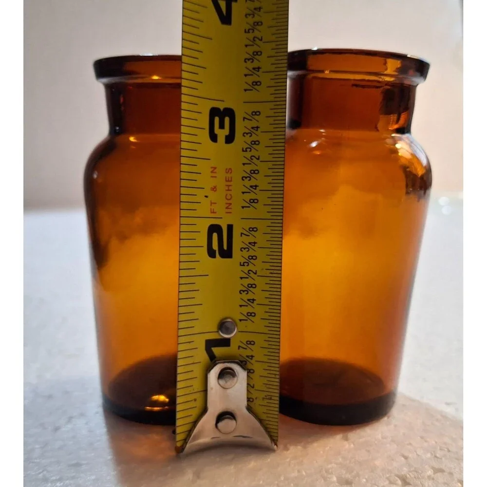 2 W Encircled Amber Glass Bottles 3 3/8